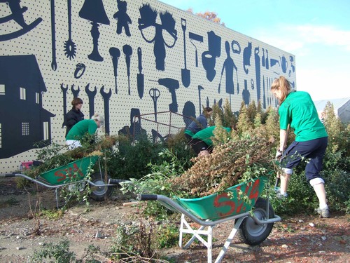 Student Volunteer Army working away in front of I Seem to Have Temporarily Misplaced My Sense of Humour by Wayne Youle, a collaboration between the Gallery and Gap Filler.