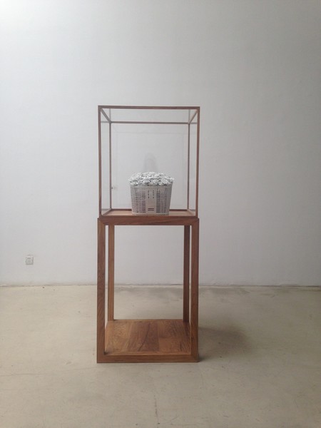 Installation view of Ai Weiwei Bicycle basket with flowers 2014. Porcelain. Chambers Fine Art, Beijing. Photo: Sophie McKinnon