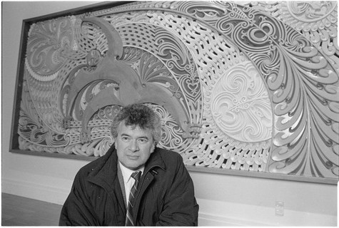 Cliff Whiting with his artwork Tawhirimatea and children 1984. Mixed media mural. Commissioned by New Zealand Meteorological Service Wellington. Photograph by John Nicholson 15 August 1992. The Dominion Post Collection, Alexander Turnbull Library