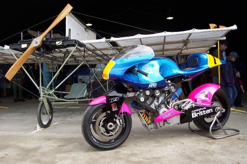 The Britten motorcyle alongside a replica of Richard Pearse's aeroplane.