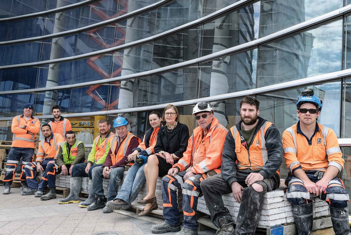 Jenny Harper with some of the Fulton Hogan team working to ensure the Gallery is open on 19 December. Left to right, Pete Colombus, Jae Taueki (seated), Jordan Anderson, David Shelley, Richard Newland, Dennis Casey, Amy Stewart, Jenny Harper, Frank Prendergast, Buster Clarkson, Jade Sibley. Photo: John Collie. With thanks to Fulton Hogan