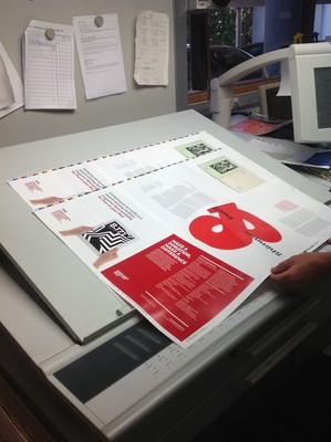 Here you can see it in production as we check the printed sheets against the colour proofs for accuracy.