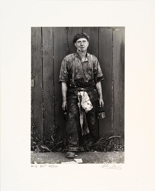 Man painting his fence, Auckland