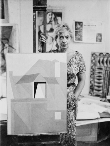 Louise Henderson in her studio with Home in Dieppe c. 1957