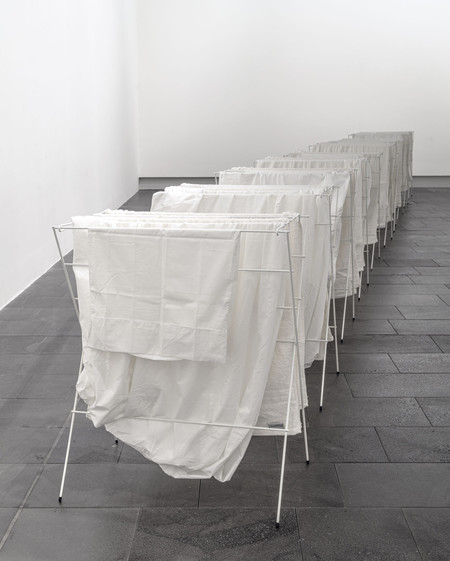 Grant Lingard Swan Song 1995–96. White enamel-coated laundry drying racks, sheets, pillowcase and towels. Collection of Christchurch Art Gallery Te Puna o Waiwhetū, gift of Trevor Fry, 2013