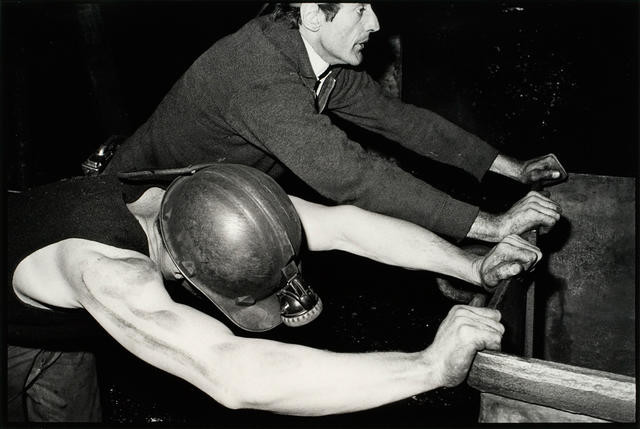 Underground In The State-owned Escarpment Coalmine Near Denniston, Two Miners Return A Coaltruck To The Face