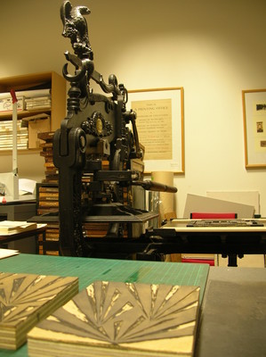 The Columbian printing press at Otakou Press with Morley's linoblocks.